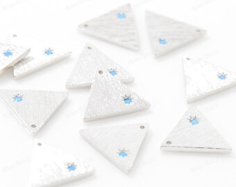 May include: A collection of silver triangle charms with a light blue gemstone in the center of each charm.