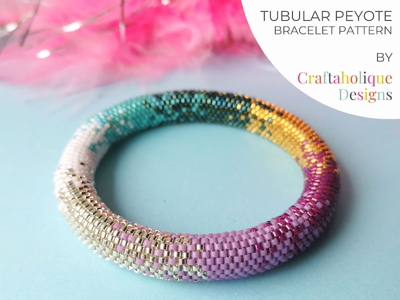 May include: A tubular peyote bracelet pattern by Craftaholique Designs. The beaded bracelet features a gradient of colors, including white, teal, gold, and pink. The bracelet is made of small, colorful beads. The text "TUBULAR PEYOTE BRACELET PATTERN" is visible.