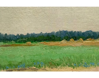 May include: An oil painting on canvas depicting a rural landscape with a vibrant green foreground featuring small blue flowers. A golden-yellow field with hay bales sits in the middle ground, backed by a dense line of dark green trees under a pale sky.