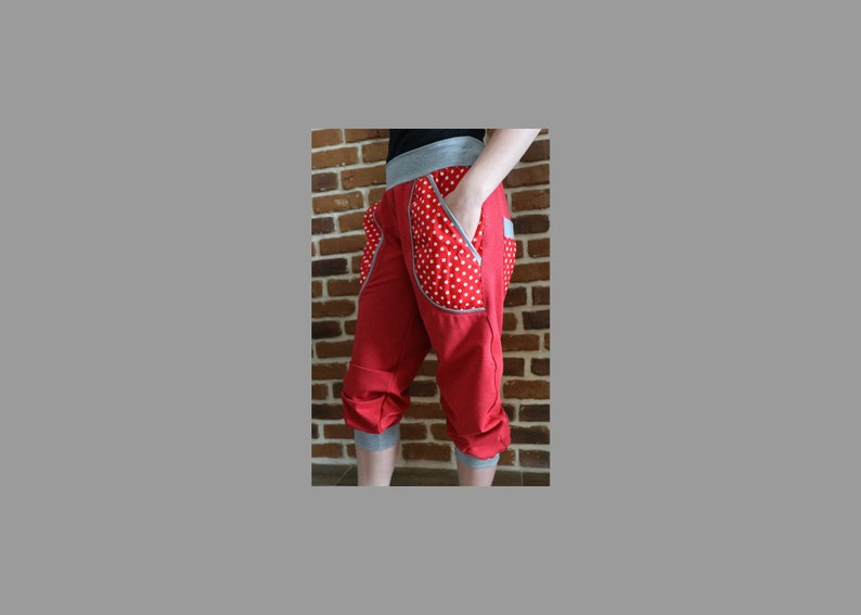 May include: Red capri pants with white polka dot pockets and a gray waistband.