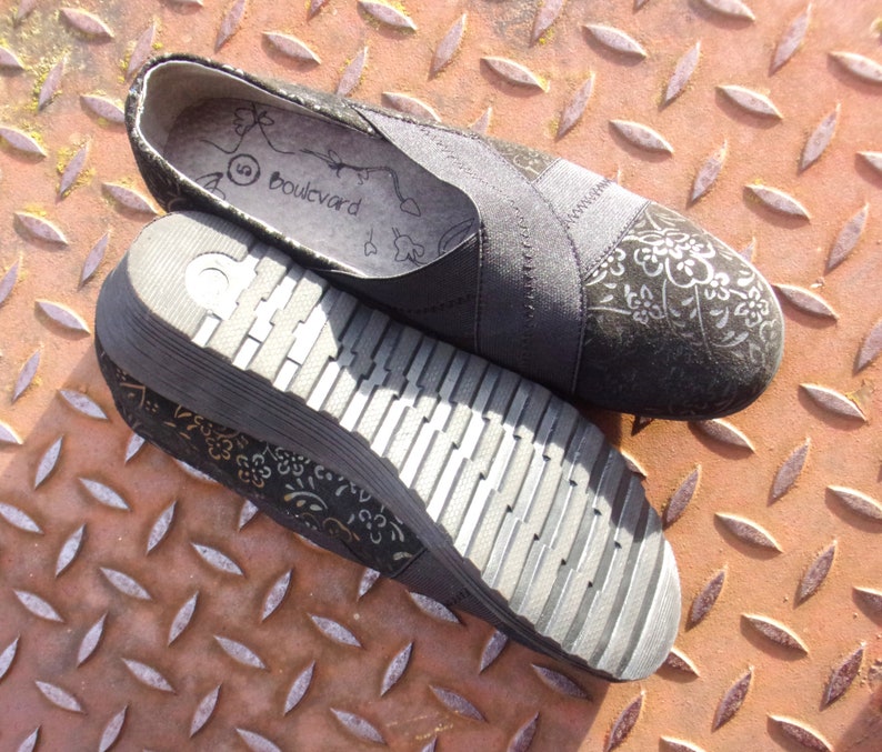 A pair of black suede wedges with floral wedge heels and damask print shoes detailing, crafted as eco leather flats in UK size 5 shoes. These arch support shoes offer comfort for daily wear, styled as casual black flats or editorial loafers. Designed as a walking comfort shoe, they feature soft sole wedges and reflect handmade footwear values. A perfect slow fashion gift, ideal for collectors of vintage style shoes.