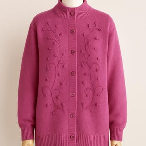 Lilac mohair oversized cardigan with textured knit and buttons worn with a black skirt.