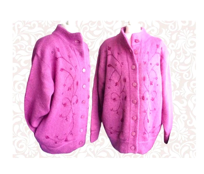 Lilac mohair oversized cardigan with textured knit and buttons worn with a black skirt.