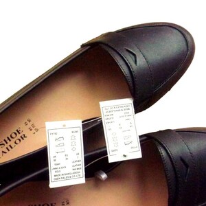 A pair of Vintage Loafers styled as Black Leather Loafers with a bow detail, these 1980s Leather Flats are timeless Bow Detail Loafers made from Soft Leather Shoes. Perfect as Retro Work Shoes, Minimalist Loafers, or Office Leather Flats, they channel Preppy Style Shoes and Quiet Luxury. Designed as Gender Neutral Shoes, they reflect Archive Fashion values and sustainable elegance in classic Leather Slip Ons.