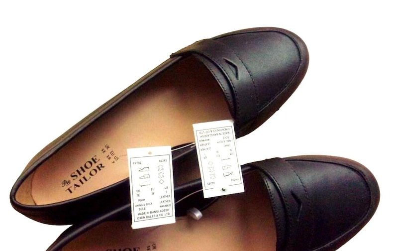 A pair of Vintage Loafers styled as Black Leather Loafers with a bow detail, these 1980s Leather Flats are timeless Bow Detail Loafers made from Soft Leather Shoes. Perfect as Retro Work Shoes, Minimalist Loafers, or Office Leather Flats, they channel Preppy Style Shoes and Quiet Luxury. Designed as Gender Neutral Shoes, they reflect Archive Fashion values and sustainable elegance in classic Leather Slip Ons.