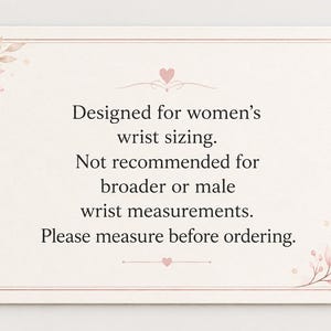 A rectangular card with rounded corners featuring a pale cream background and a thin pink border. Delicate pink leaf illustrations decorate the top-left and bottom-right corners. The text reads: Designed for women's wrist sizing. Not recommended for broader or male wrist measurements. Please measure before ordering.