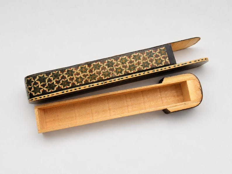 Vintage marquetry wooden pen holder with removable sliding sleeve and empty storage compartment, photographed in a clean white studio to showcase handcrafted Persian artistry.