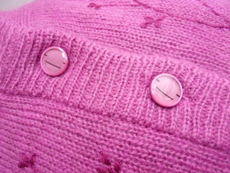 Lilac mohair oversized cardigan with textured knit and buttons worn with a black skirt.