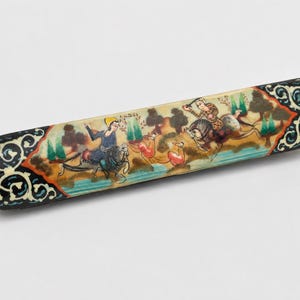 Vintage Persian miniature wooden pen holder in a white studio, showcasing detailed hand-painted hunting scene, intricate marquetry accents, and timeless handcrafted desk decor.
