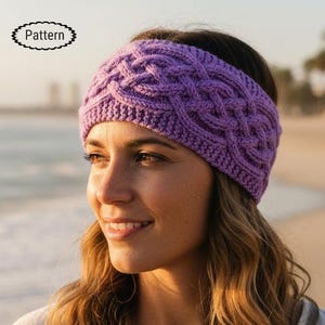 May include: A knitted purple headband with a cable knit design. The headband is made of a soft yarn and is worn on the head. The word "Pattern" is in a black oval in the upper left corner.