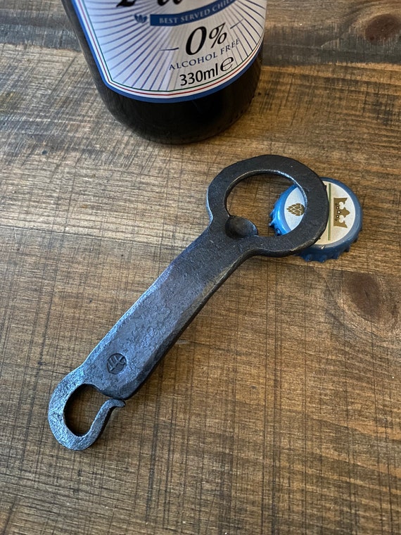 A blacksmith actually hammers your name or message into iron — making this a tactile, functional piece of forged craft that's a perfect 6th anniversary or groomsmen gift.