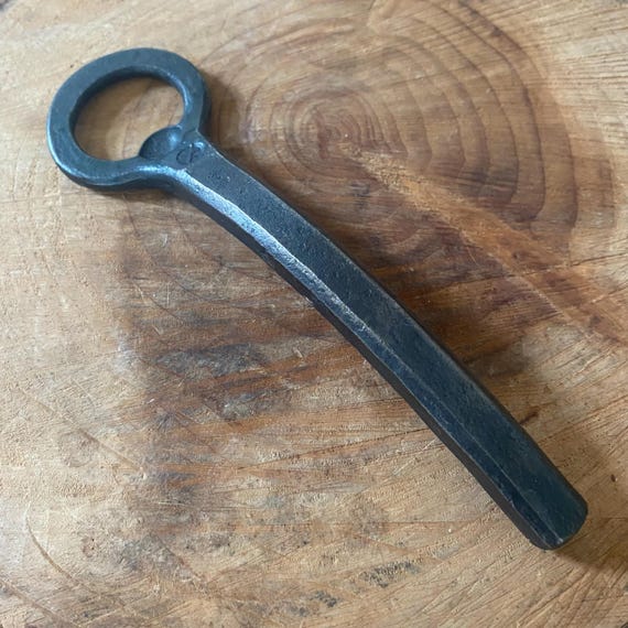 352 favorites don't lie — a blacksmith-personalised iron opener that doubles as the perfect 6th (iron) anniversary gift, stamped with your name or date.