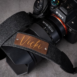 May include: A handmade wooden sign with the text "Welcome to our home" in a handwritten style. The sign is painted white with black lettering and a distressed finish, perfect for home decor.
