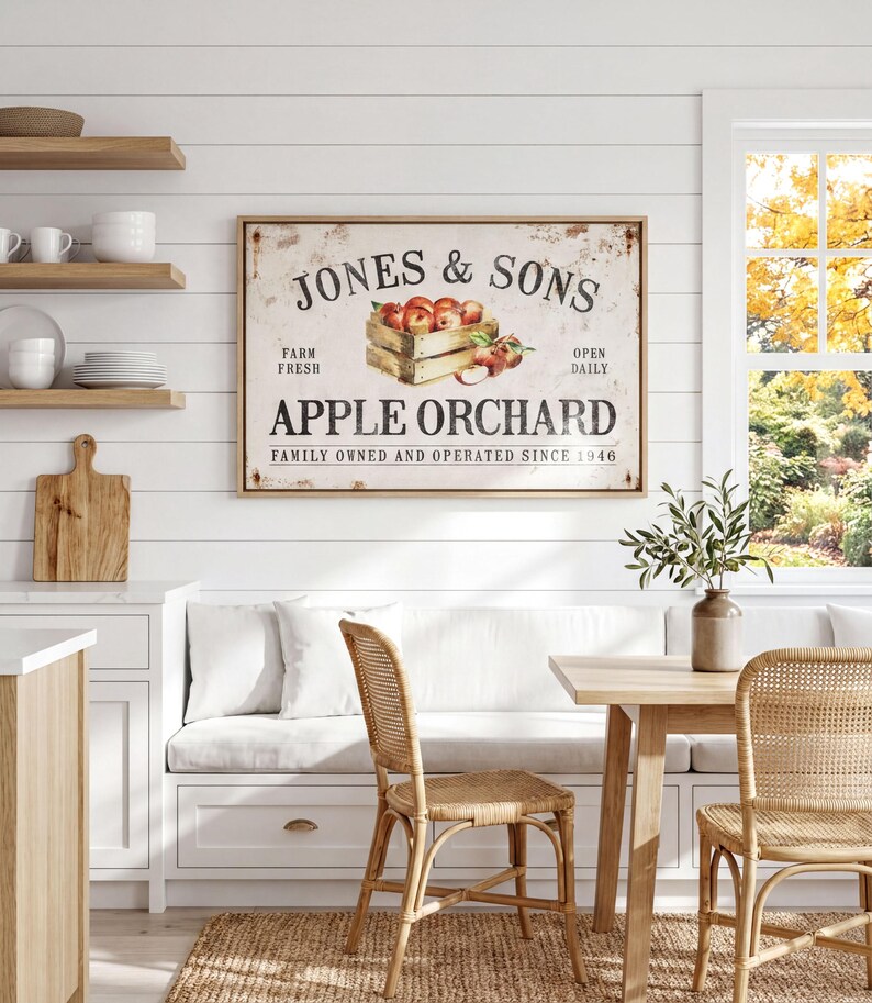 a cozy kitchen scene with a rustic wooden table and chairs, a framed sign for Jones & Sons Apple Orchard, and shelves displaying various kitchen items.