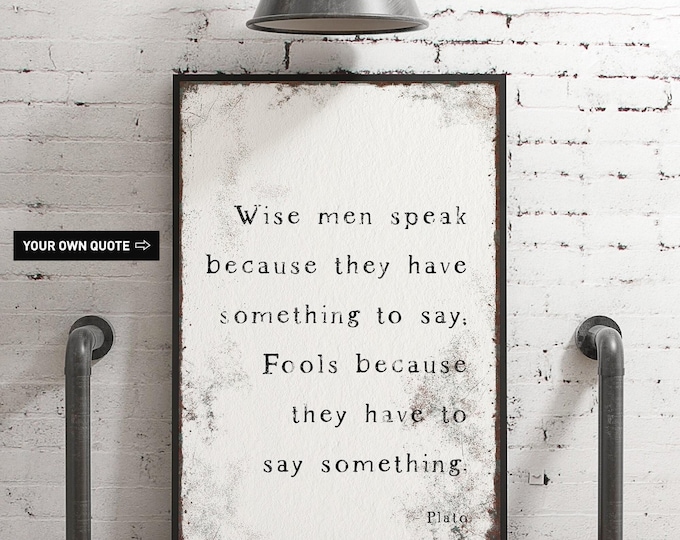 Plato typography print, white quote sign framed in black for a study