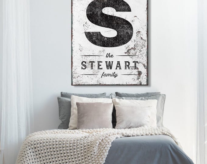 Distressed monogram letter art with family name and established year