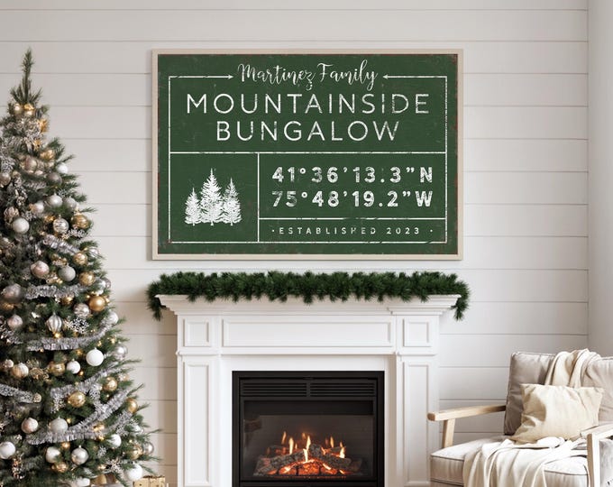 Family name arrow sign with pine trees, GPS coordinates and established year