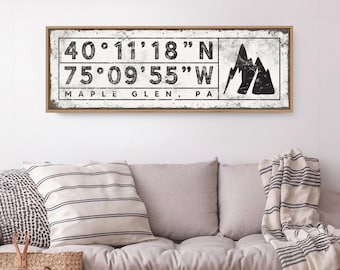 Peaks and coordinates on a mountain sign, your place name in black and white