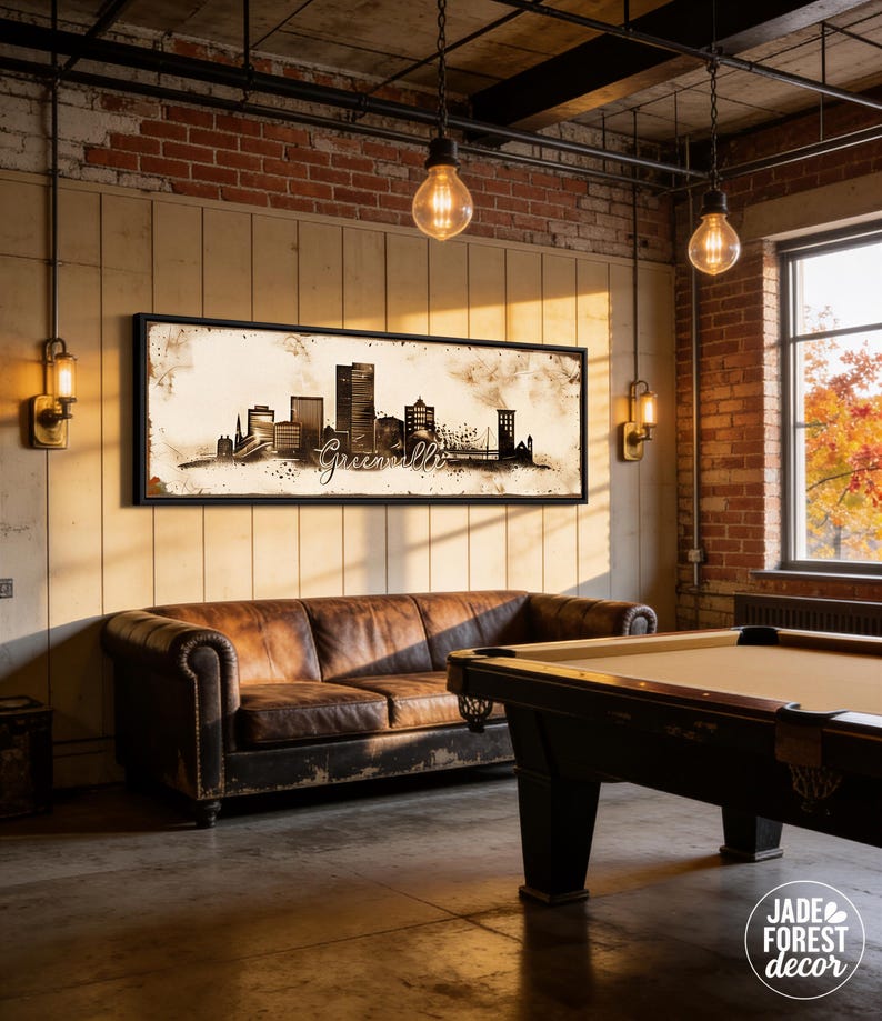 a cozy living room with a pool table, a leather couch, and a large framed artwork depicting a city skyline.