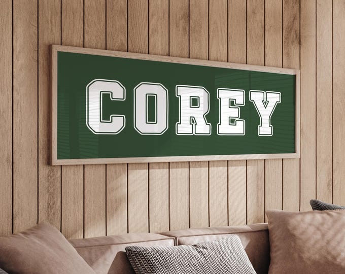 Dark green name sign, white lettering in vintage athletic block type