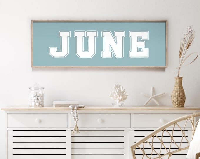 Block letter art in tide blue, custom name sign with outlined varsity type