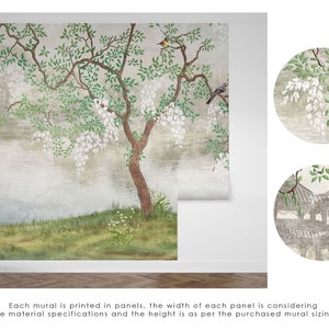 May include: A wall mural featuring a landscape scene with a large tree, white hanging flowers, and birds. A crane stands on the grassy bank near a body of water. Two circular insets show close-up details of the foliage and a pagoda structure.
