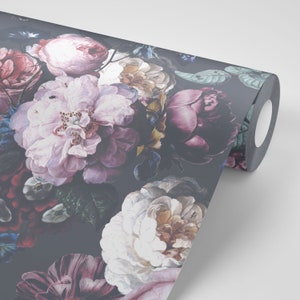 May include: A roll of wallpaper featuring a dark gray background with a dense floral pattern of large, blooming peonies and roses in shades of light pink, deep magenta, white, and dark red, interspersed with dark green leaves and small buds.