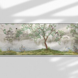 May include: A panoramic wall art print featuring a serene landscape with a calm lake, a traditional pagoda, and an arched stone bridge. A central tree with white blossoms and green leaves stands on the grassy bank, accompanied by small birds.