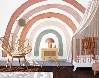 May include: A nursery room with a large watercolor rainbow wall mural, a white crib with a canopy, a wicker chair, a wooden nightstand with a lamp, and a pink ottoman.