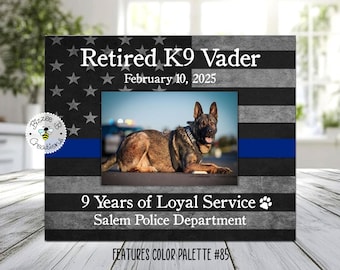 May include: A black and gray photo frame with a blue stripe and a white star pattern. The frame has a photo of a German Shepherd dog in it. The text on the frame reads "Retired K9 Vader", "February 10, 2025", "9 Years of Loyal Service", and "Salem Police Department".