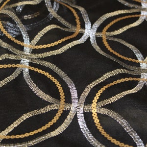 Black Stretch Mesh with Silver thread and Gold Sequins Print