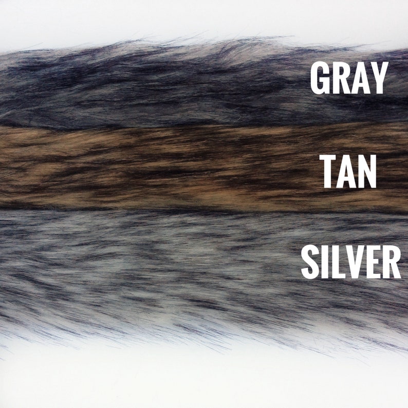 May include: Three strips of faux fur in gray, tan, and silver colors. The fur is soft and fluffy.