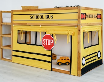 May include: A yellow and black school bus-themed loft bed with the words "SCHOOL BUS" on the top. The bed has a "STOP" sign and a toy school bus inside. The bed has a wooden frame and a yellow fabric covering the lower level.