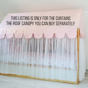 May include: Pink and white curtains with scalloped edges hang from a wooden frame. The text "THIS LISTING IS ONLY FOR THE CURTAINS THE ROOF CANOPY YOU CAN BUY SEPARATELY" is printed on the pink fabric.