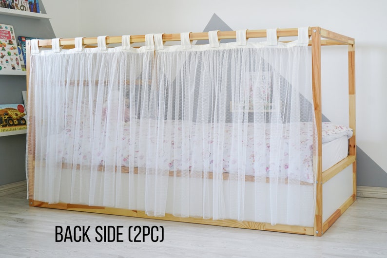 May include: White sheer curtains with a wood frame, hanging from a wooden rod. The curtains are labeled "BACK SIDE (2PC)".