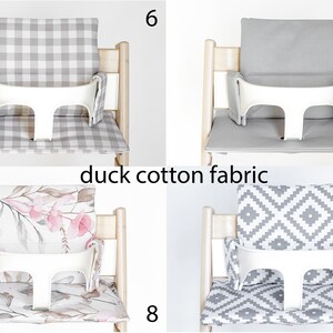 May include: Four high chair cushions with different patterns. The cushions are made of duck cotton fabric. The patterns include a gray and white gingham, a solid gray, a floral print, and a gray and white geometric pattern. The cushions are all attached to a white high chair.