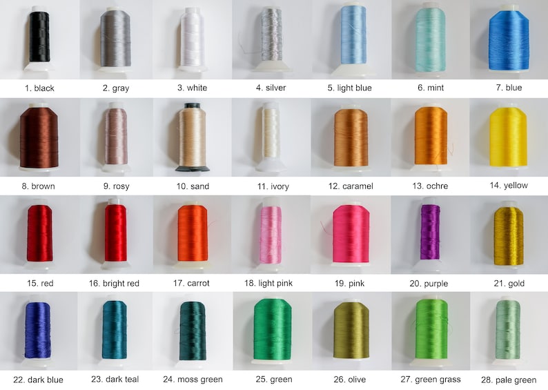 May include: A collection of 28 spools of thread in various colors, including black, gray, white, silver, light blue, mint, blue, brown, rosy, sand, ivory, caramel, ochre, yellow, red, bright red, carrot, light pink, pink, purple, gold, dark blue, dark teal, moss green, green, olive, green grass, and pale green.