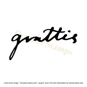 May include: Black and white rubber stamp with the word "grattis" written in a cursive script.