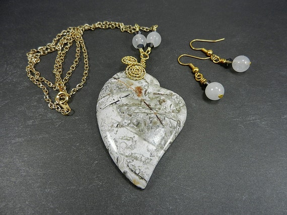 Heart Shaped Tree Agate Gemstone Pendant with a White Background and Green and Grey Lines Gold Wire Wrapped with Matching Earrings