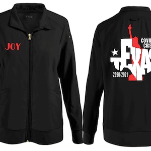 May include: Black zippered jacket with the word "JOY" in red on the front and the words "FRONT LINER" in white on the left sleeve. The back of the jacket features a white outline of the state of Texas with the word "TEXAS" in white letters and the words "COVID-19 CRISIS 2020-2021" in red letters.