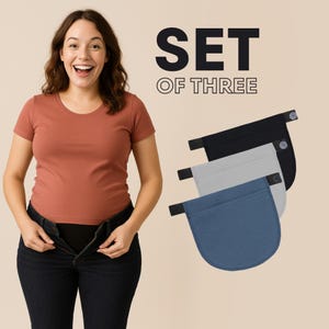 Könnte beinhalten: Set aus drei schwarzen, grauen und blauen Stoff-Bundverlängerungen. Jeder Verlängerer hat einen Knopf und ein elastisches Band.