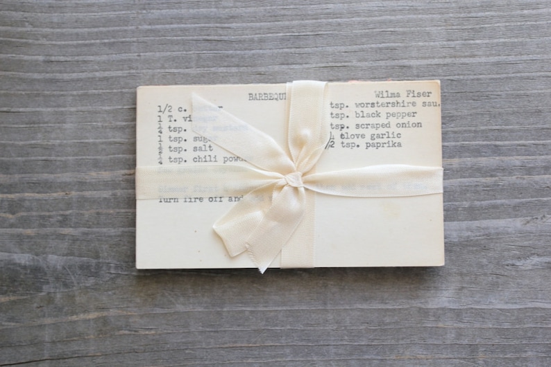 Vintage recipe cards tied with a cream-colored ribbon.