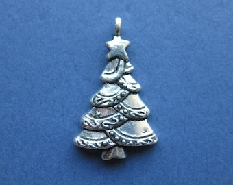 May include: Silver Christmas tree charm with a star on top. The tree is decorated with a beaded garland and swirls.