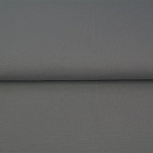 Könnte beinhalten: Ein einfarbiger grauer Stoffmuster. Der Stoff hat eine glatte, gleichmäßige Textur.