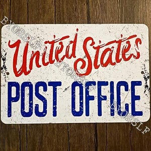May include: Rectangular metal sign with the words "United States" in red script above "POST OFFICE" in blue block letters. The sign has a distressed, vintage look with a white background and black speckling.