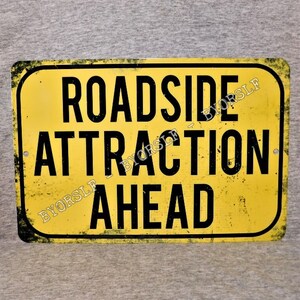 Metal Sign ROADSIDE ATTRACTION ahead highway tourist novelty architecture monuments travel American sculpture wall hanging man cave decor