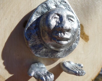 Semblance, fine art sculpture, recycled aluminum sculptural wall mount, face and hands sculpture, spiritual art