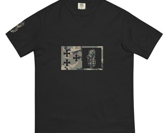 May include: Black t-shirt with a camouflage print and a pineapple grenade graphic.