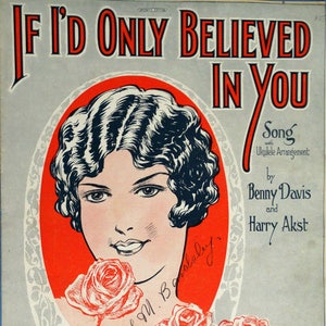 May include: A vintage sheet music cover featuring a woman with dark curly hair and a red rose. The title of the song is "If I'd Only Believed In You" by Benny Davis and Harry Akst.