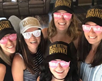 I'm getting married we're getting drunk hats, Squad hats, Bachelorette Hats, Trucker Hat, Custom Hat, Bridal Party Hats, wedding party hats